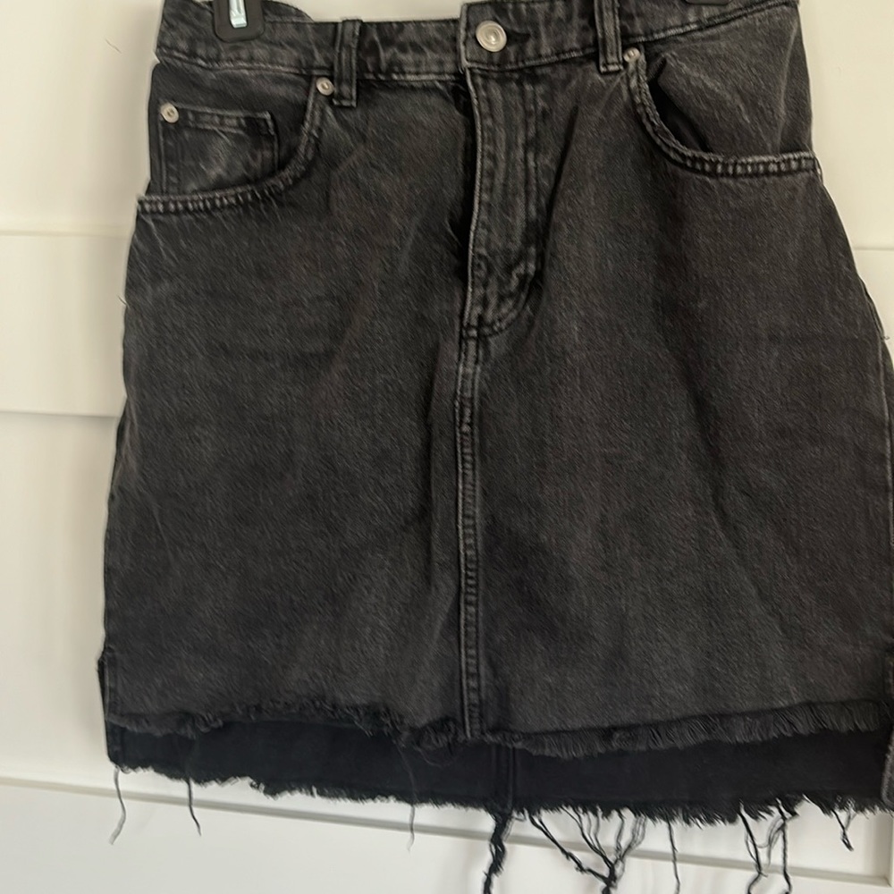 H&M size 10 high low black denim skirt with acid wash.